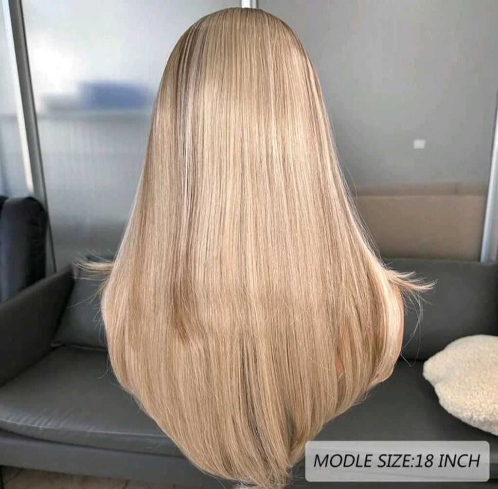 Blonde wig displayed on a mannequin head with a neutral background