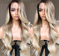 Blonde wig on a mannequin head with a neutral background