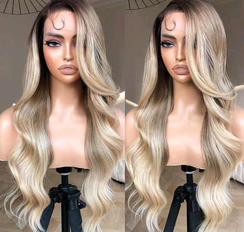 Blonde wig on a mannequin head with a neutral background